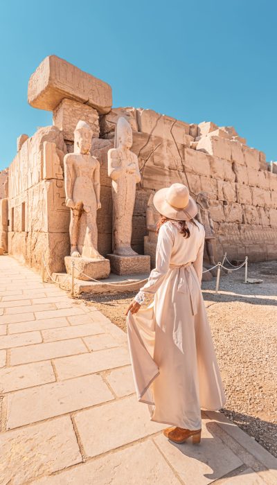Woman,Traveler,Explores,The,Ruins,Of,The,Ancient,Karnak,Temple